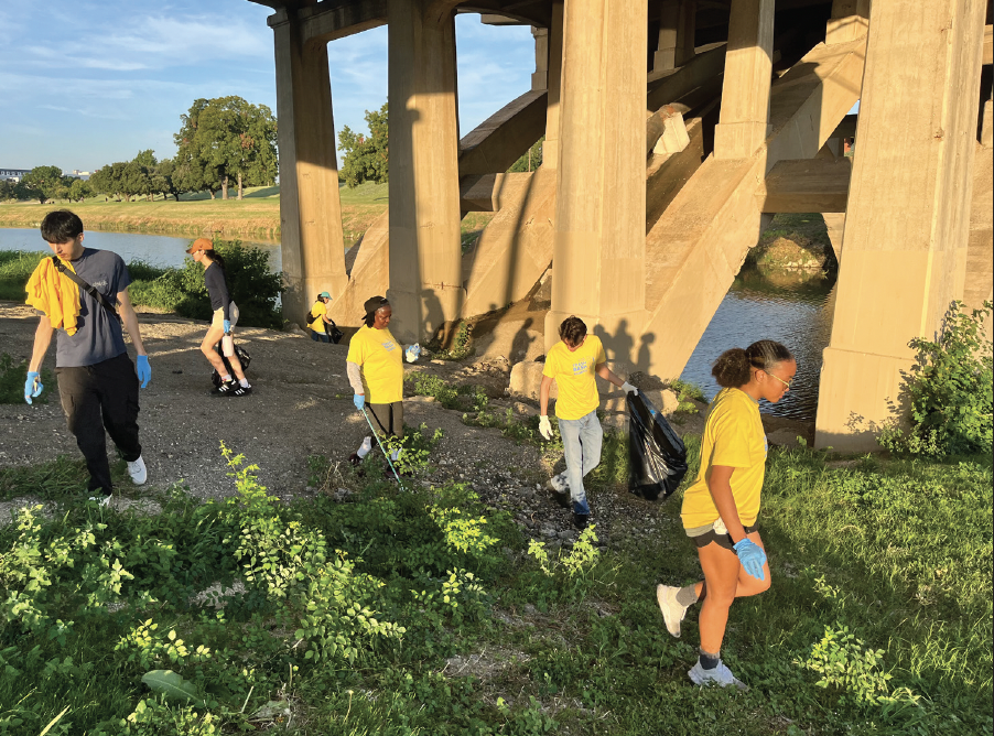 Students pick up junk under a bridge behind TR Campus during the Trash Bash
event hosted Sept. 21 by the Tarrant Regional Water District.